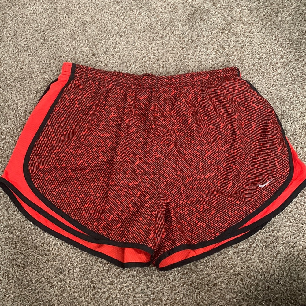 Red Nike running shorts